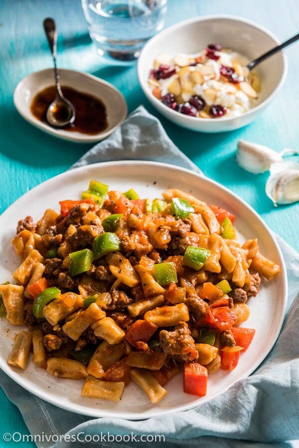 Ding Ding Chao Mian (丁丁炒面) - A hearty fried noodle dish that is cooked with a scrumptious tomato sauce with lamb and peppers. Fast to cook and bold in flavor. A must-have for Xinjiang food lovers. 