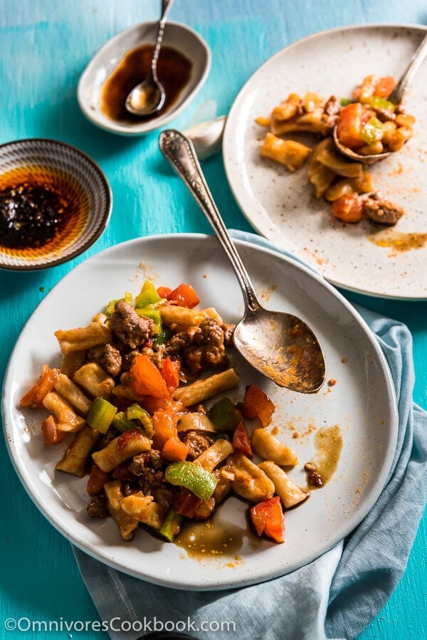 Ding Ding Chao Mian (丁丁炒面) - A hearty fried noodle dish that is cooked with a scrumptious tomato sauce with lamb and peppers. Fast to cook and bold in flavor. A must-have for Xinjiang food lovers. 