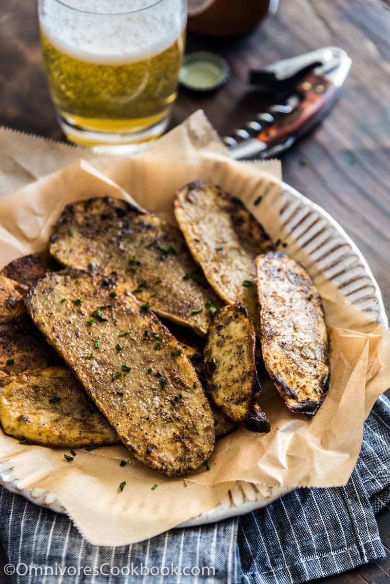 Cook the best grilled potato by slicing it finely, grill until blistered on the surface and creamy in texture. Add cumin and chili powder to spice it up.