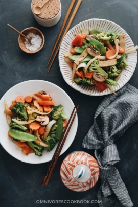 Stir fried vegetables including onion, broccoli, carrot, mushroom, bamboo shoot, and snow peas