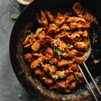 Sweet and Sour Pork (糖醋里脊) | Introducing the authentic Chinese sweet and sour pork made with lightly battered pork, pan-fried until crispy, juicy, and tender, then tossed in a fragrant sticky sauce with a perfectly balanced sweet and sour taste. It’s super easy to make and tastes way better than takeout! {Gluten-free Adaptable}