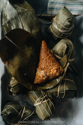 Savory zongzi on bamboo leaves