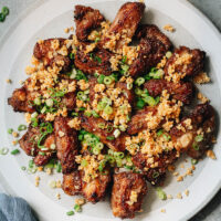 Sharing a super easy and addictive air fryer ribs recipe that is inspired by Chinese fried garlic ribs. The ribs are juicy, tender, very flavorful, coated with a crispy crust and finished up with crispy garlic bits. If you are looking to enjoy ribs without guilt, you should make this air fryer version for a delicious and healthy meal with wholesome ingredients. {Gluten-Free Adaptable}