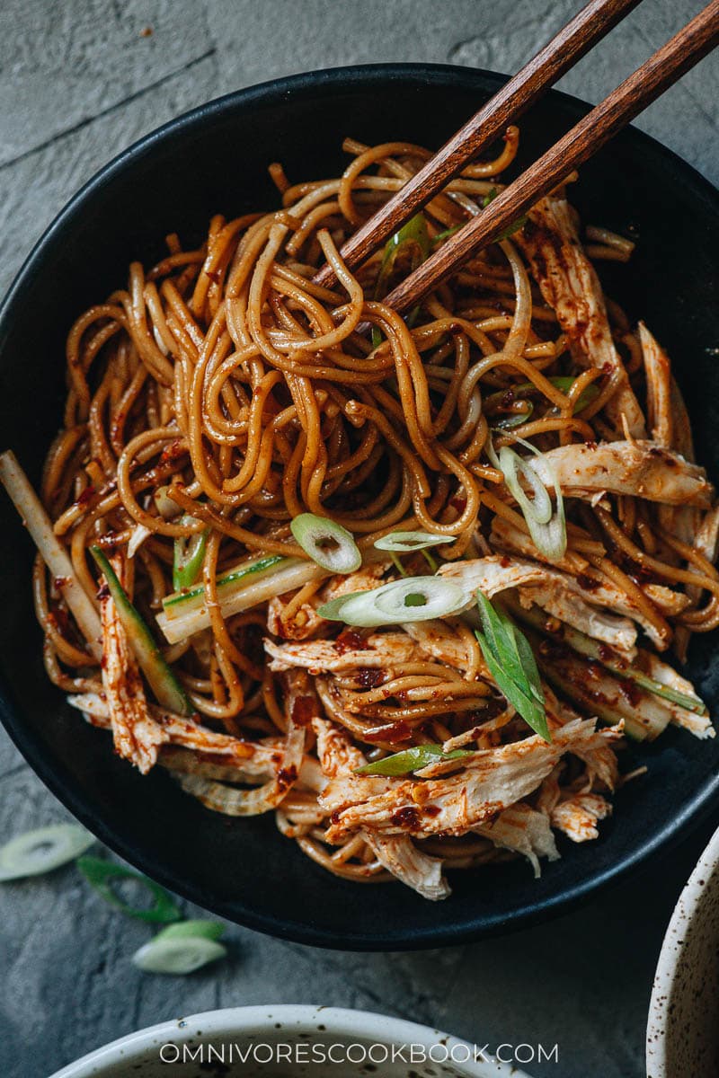 Chinese chicken noodle salad garnished with cucumber