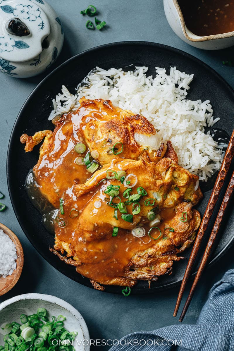 Chinese omelet over white rice with gravy