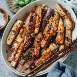 This Sichuan style eggplant salad with spicy garlic dressing is an easy, delicious way to enjoy eggplant. The eggplant is steamed until tender, then mixed with an aromatic dressing that is savory and spicy. Serve it as an appetizer or side dish to add a tasty vegetable to your meal. {Vegan, Gluten-Free Adaptable}