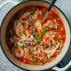 This Chinese tomato beef soup features a sweet and tart tomato broth with tender thin sliced beef and mushrooms. Serve it over rice or noodles, it is the perfect one-pot meal to keep you warm during the colder months. {Gluten-Free Adaptable}